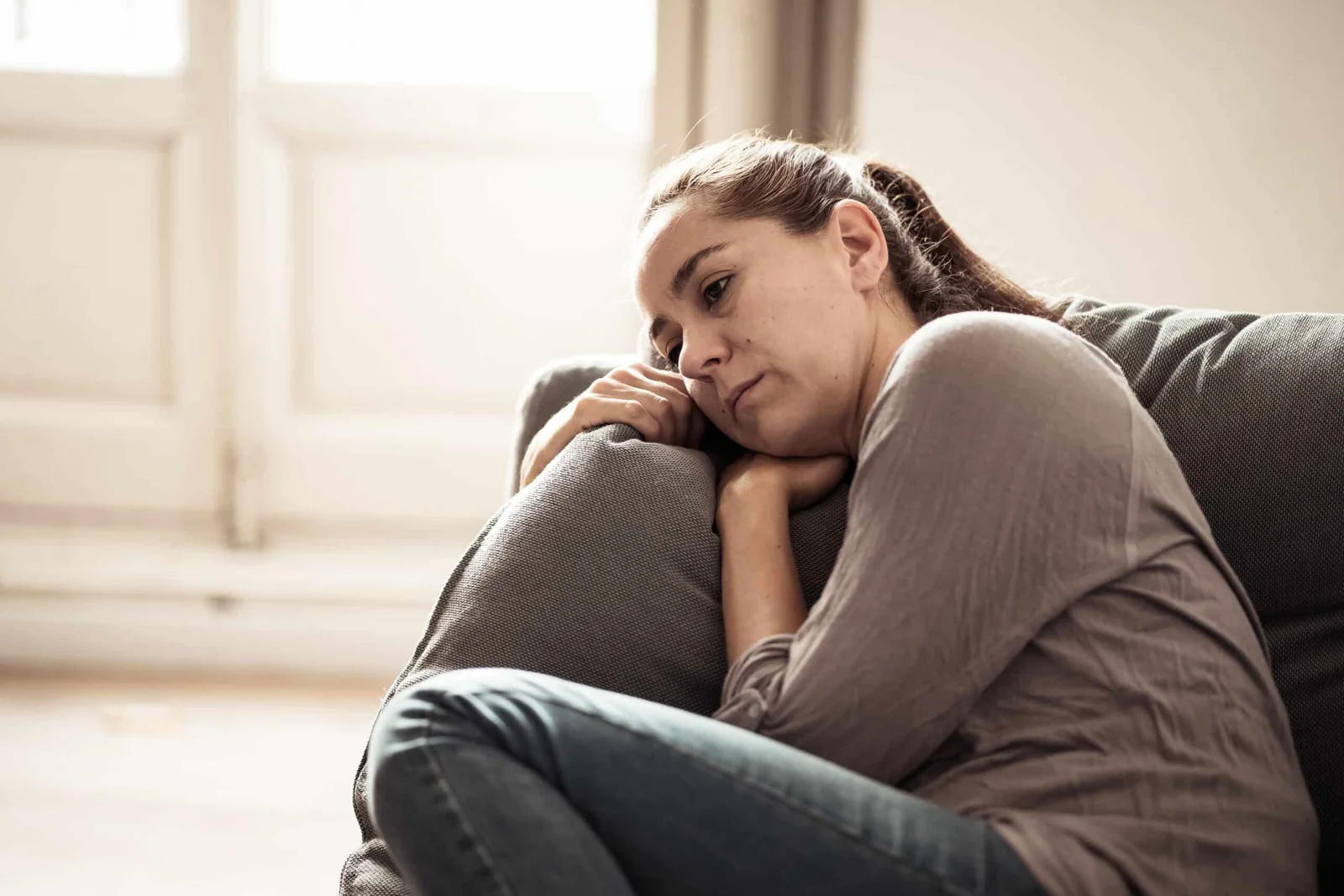 Woman struggling with mental health concerns seeking natural wellness support